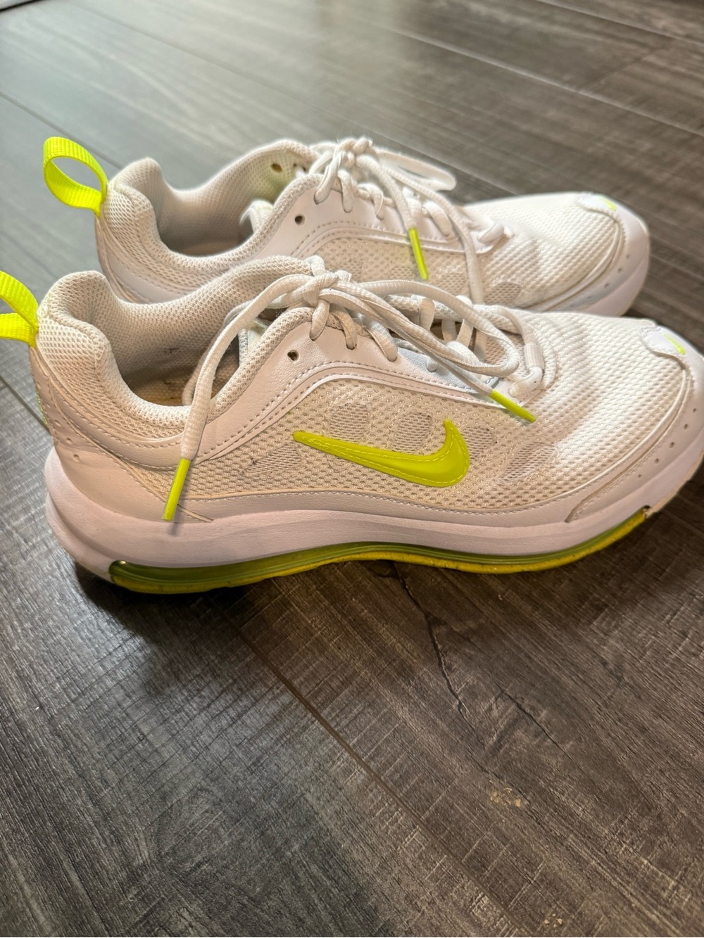 Nike' White Sneakers with Neon Yellow Swoosh